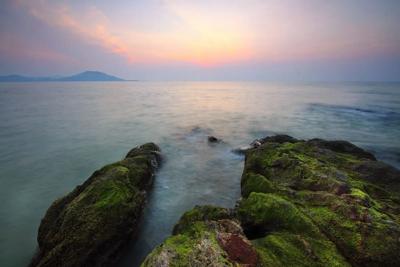 Calm ocean coastline at sunrise, a symbol of hope and new beginnings